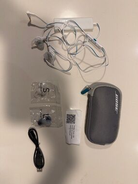 Bose White Earbuds with Light Blue Accents and Gray Zip Case